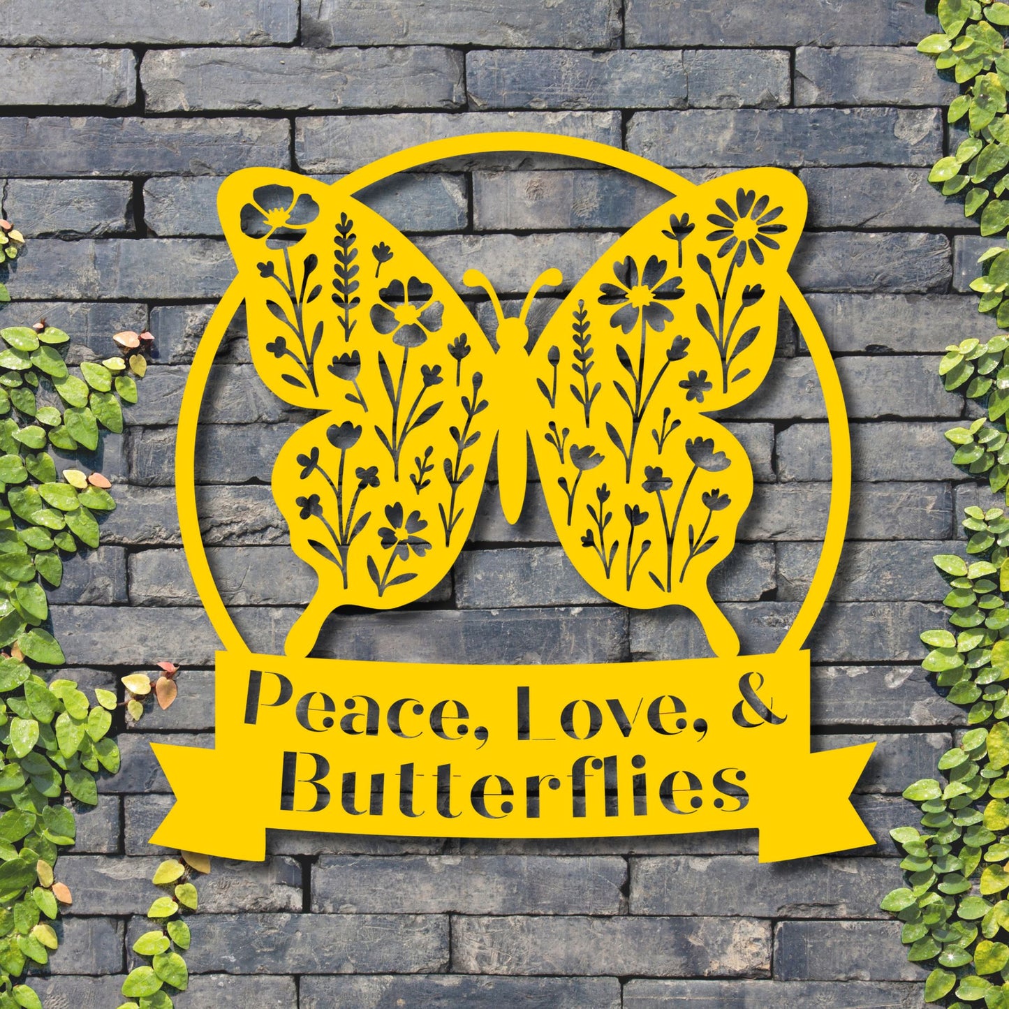 Yellow butterfly-shaped decorative sign with 'Peace, Love, & Butterflies' text on a stone wall background.