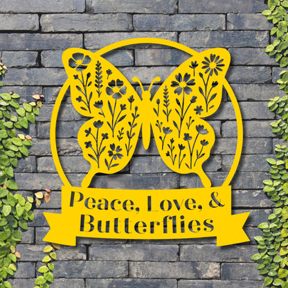 Yellow butterfly-shaped decorative sign with 'Peace, Love, & Butterflies' text on a stone wall background.