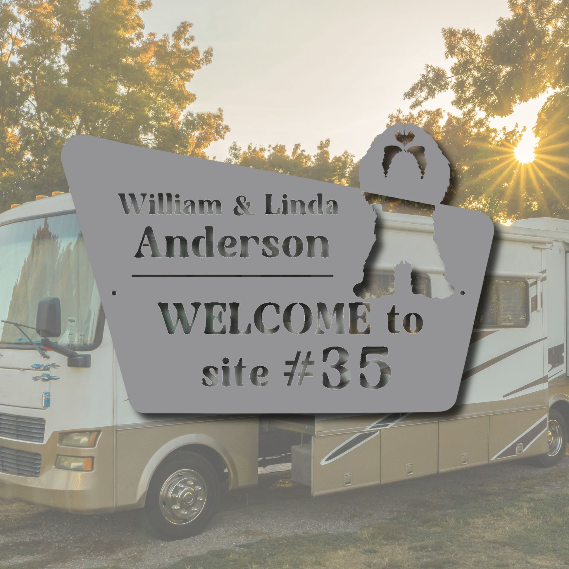 Personalized welcome sign for William & Linda Anderson in front of an RV with a sunset background.