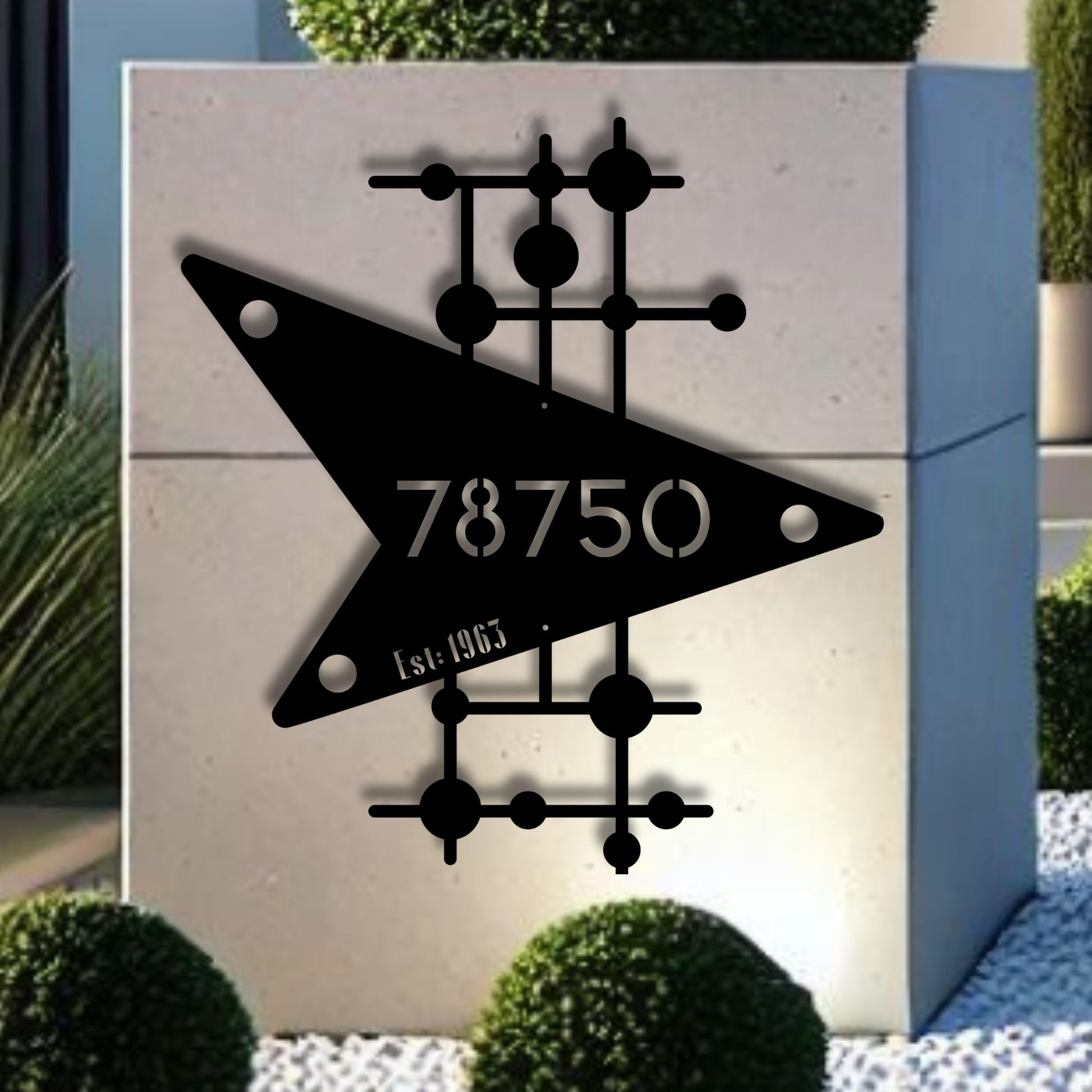 Decorative metal wall art with geometric design and numbers on a light background