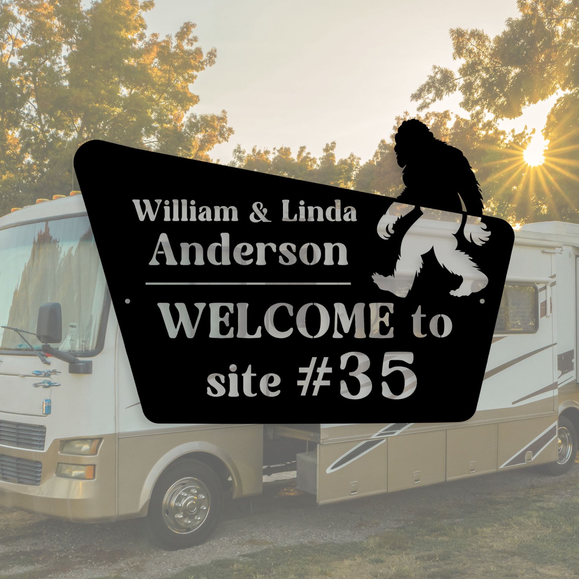 RV with a personalized welcome sign featuring a silhouette of a person and 'Bigfoot' at sunset.