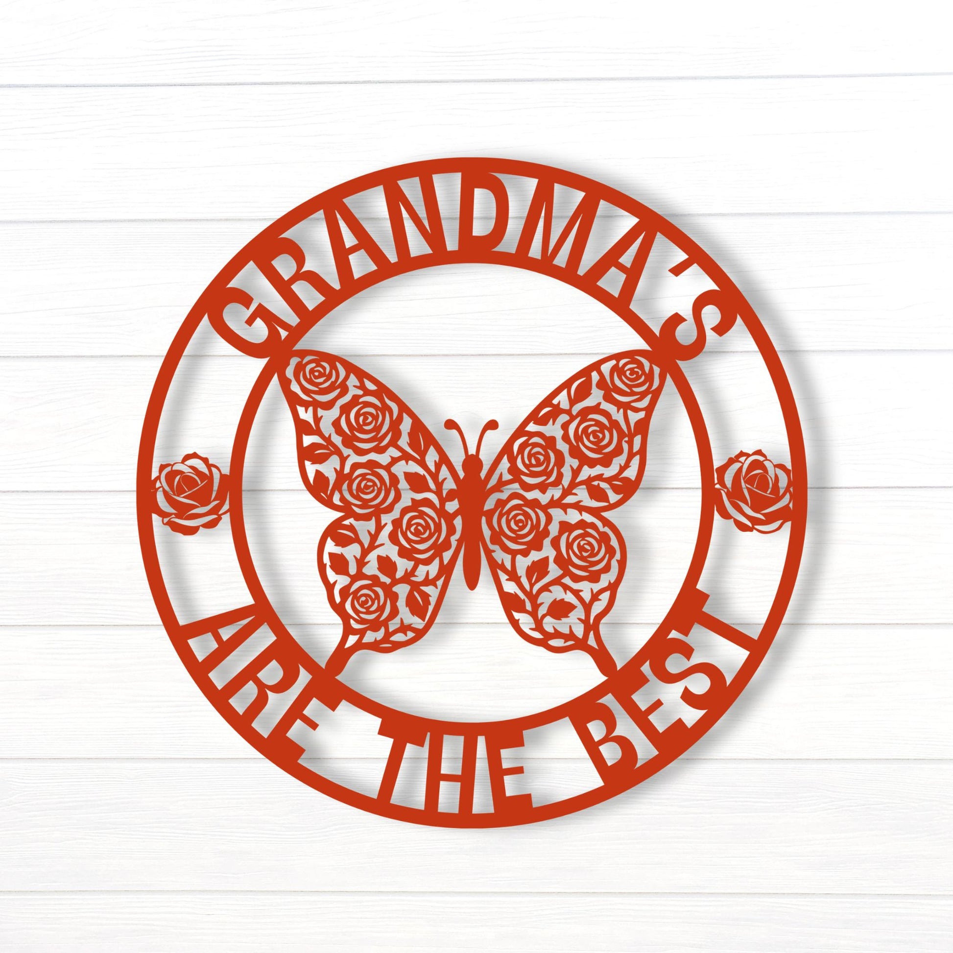 Decorative sign with butterfly and roses design on a white wooden background