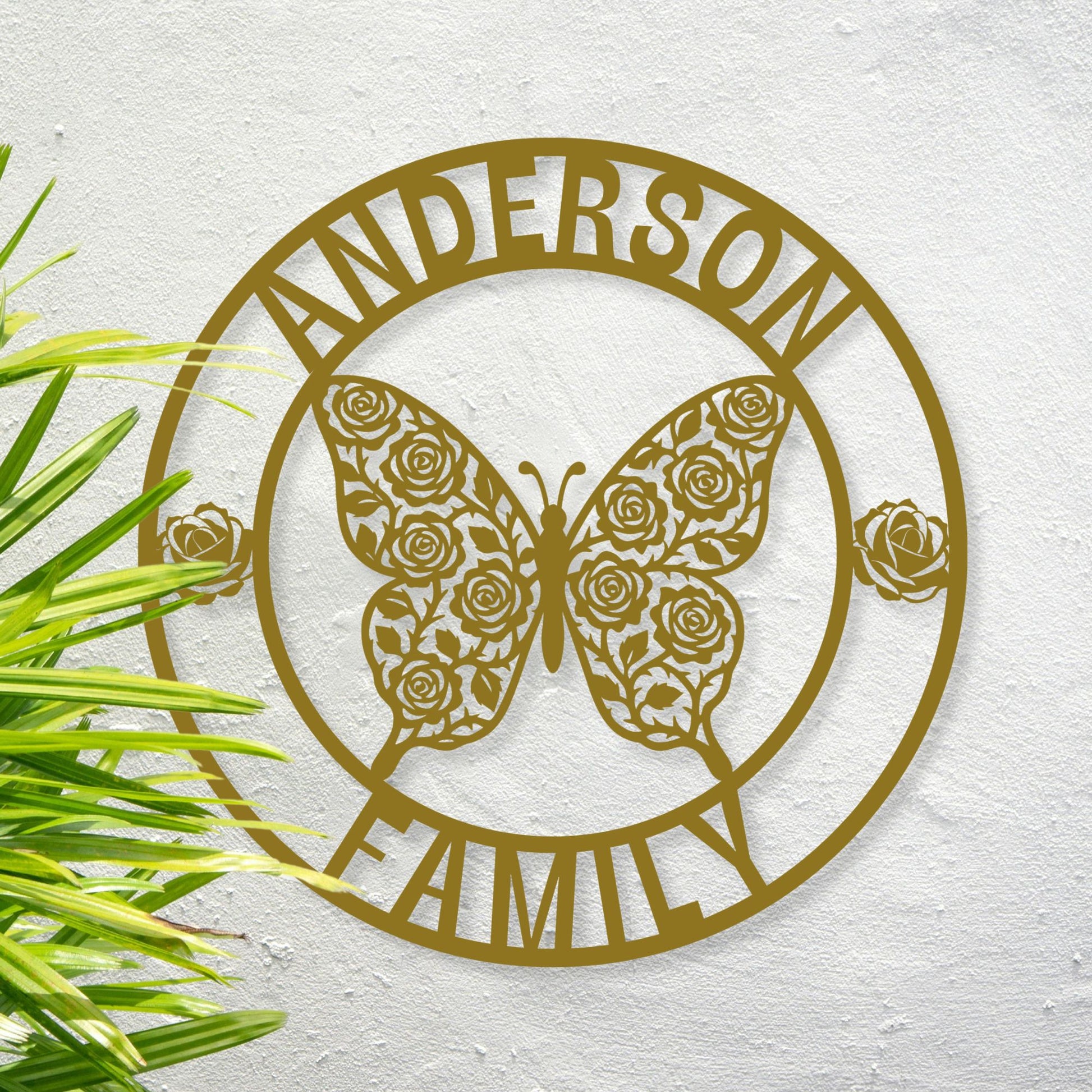 Decorative metal sign with butterfly and roses design, featuring the text 'Anderson Family', on a textured white background.