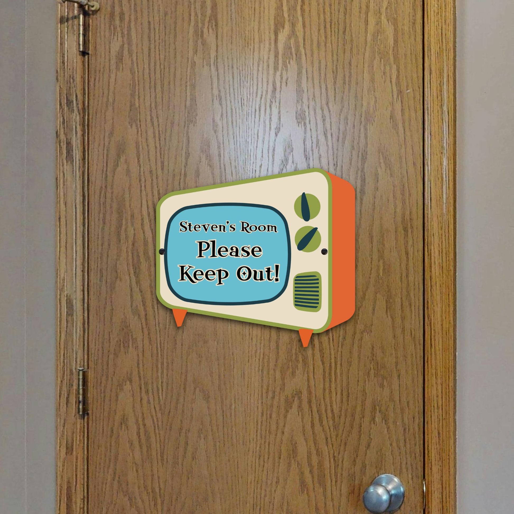 Vintage-style door sign with 'Steven's Room Please Keep Out!' text on a wooden door.