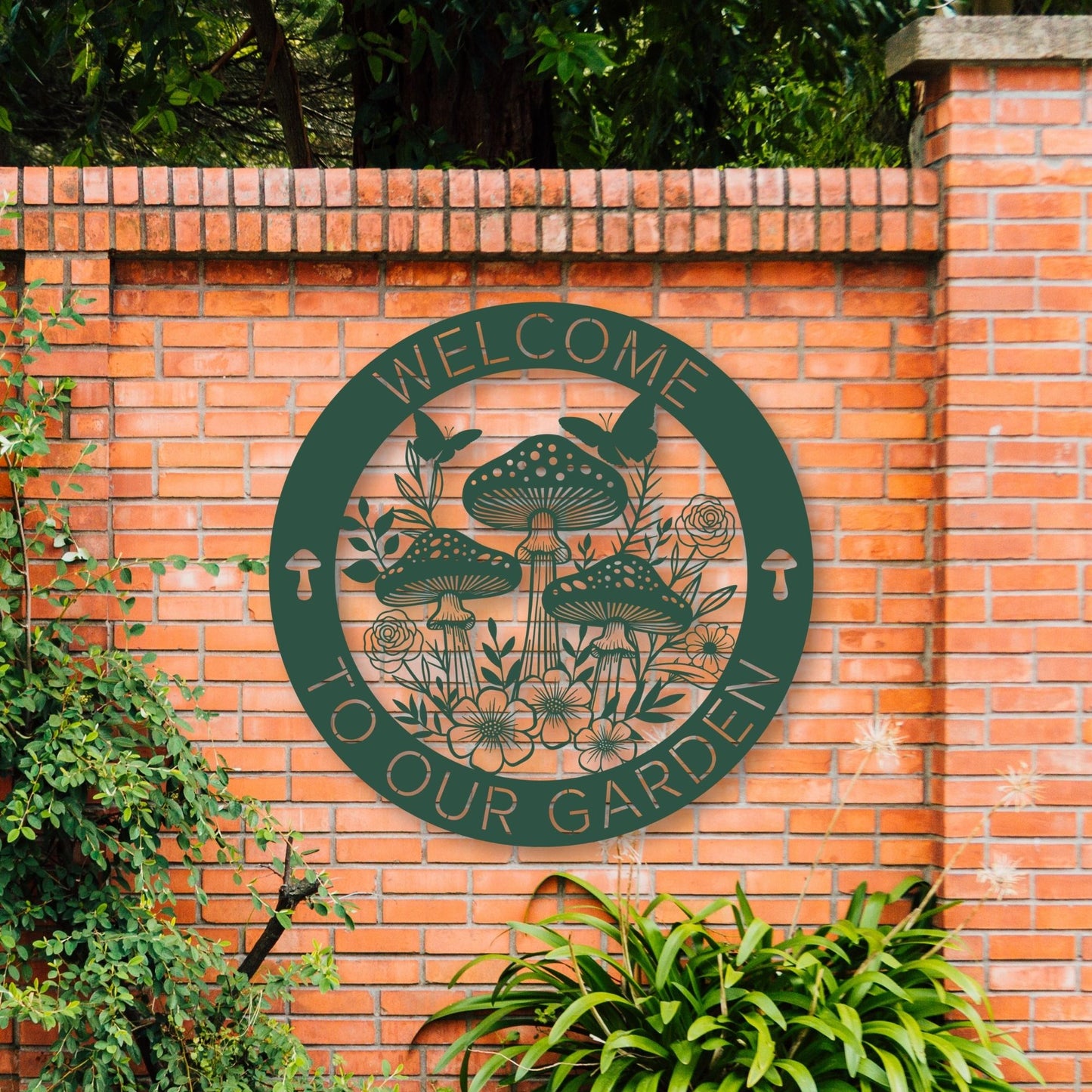 Brick wall with a green 'Welcome to Our Garden' sign featuring mushrooms and plants.