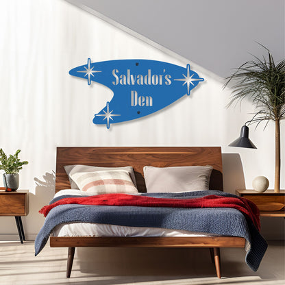 Bedroom with a wooden headboard and personalized blue wall art above it.