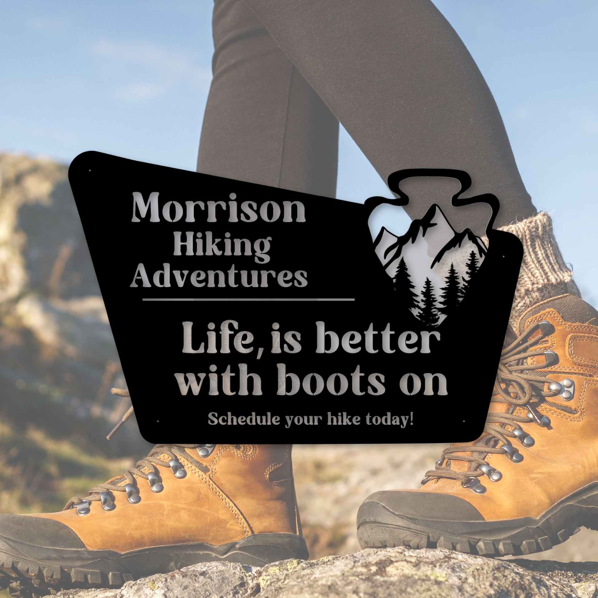 Hiking boots with a promotional sign for Morrison Hiking Adventures.