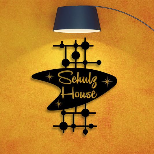 Decorative wall art with 'Schulz House' text on an orange background