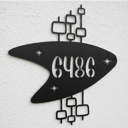 Decorative metal wall art with abstract shapes and numbers '6486' on a textured white background