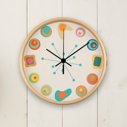 Colorful wall clock with abstract designs on a white wooden background