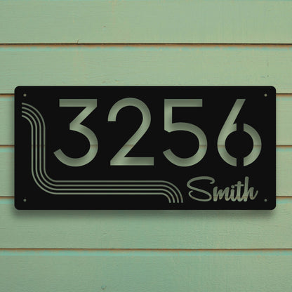 House number sign with '3256 Smith' on a green wooden background