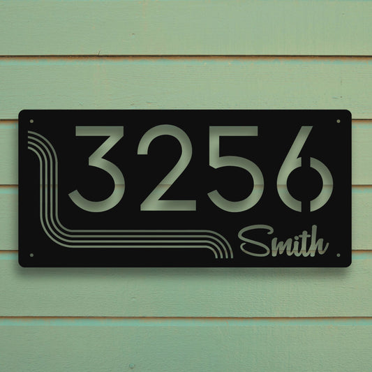 House number sign with '3256 Smith' on a green wooden background