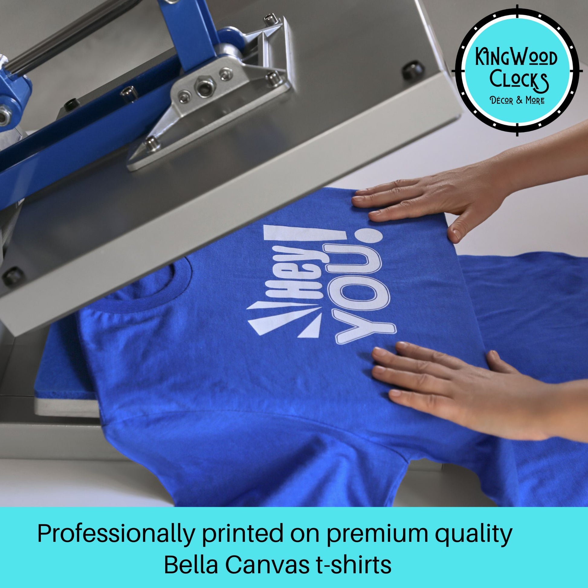 Blue t-shirt with a printed design on a screen printing machine, with 'Kingwood Clocks' logo in the corner.