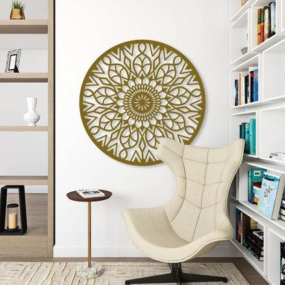 Decorative wall art with a mandala design in a room with a chair and bookshelves.