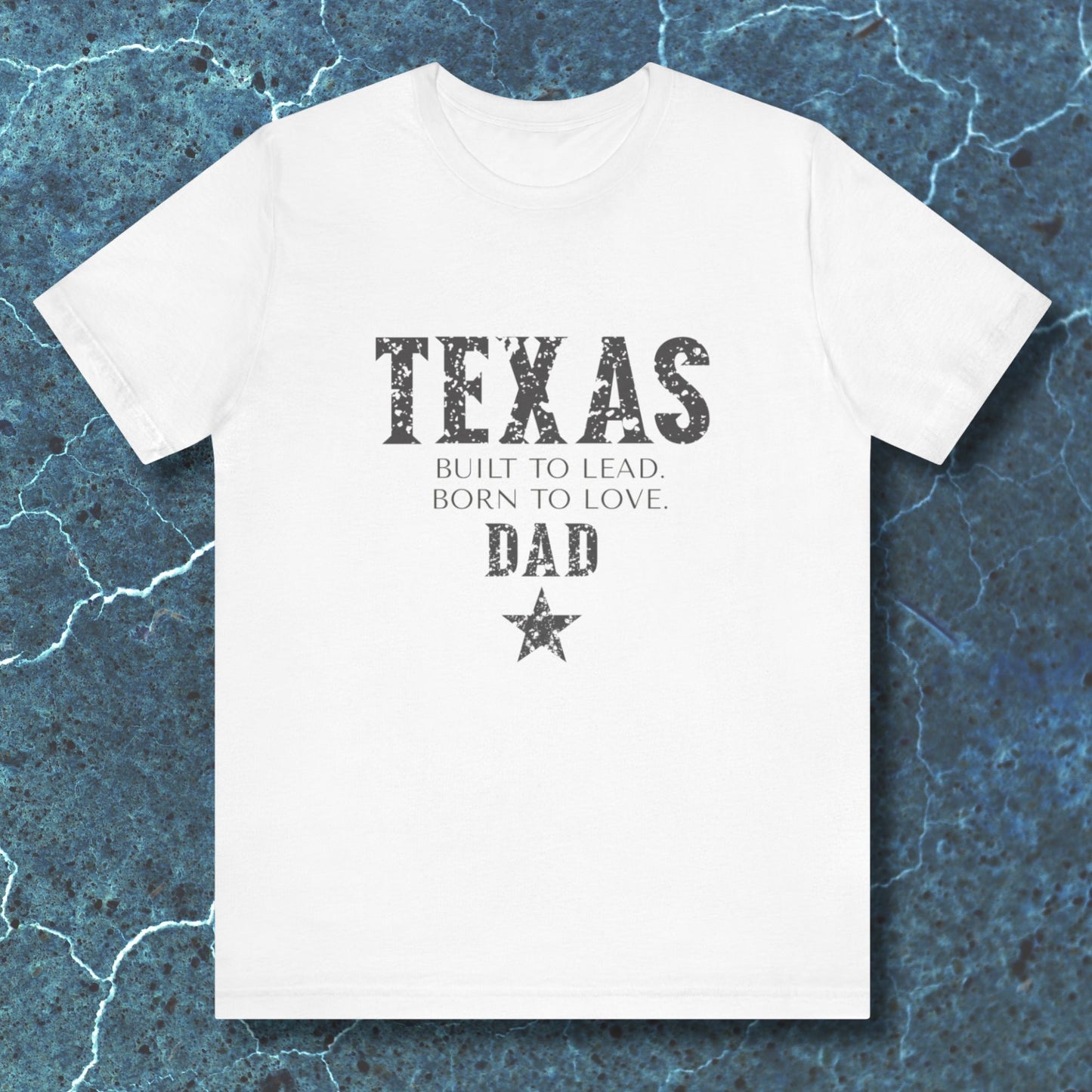 White t-shirt with 'TEXAS' text on a textured blue background