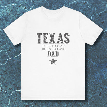 White t-shirt with 'TEXAS' text on a textured blue background