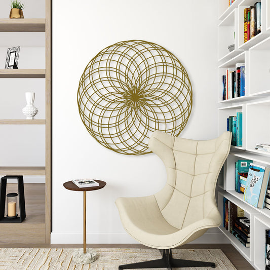 Beige armchair in a room with a geometric wall art piece and bookshelves.