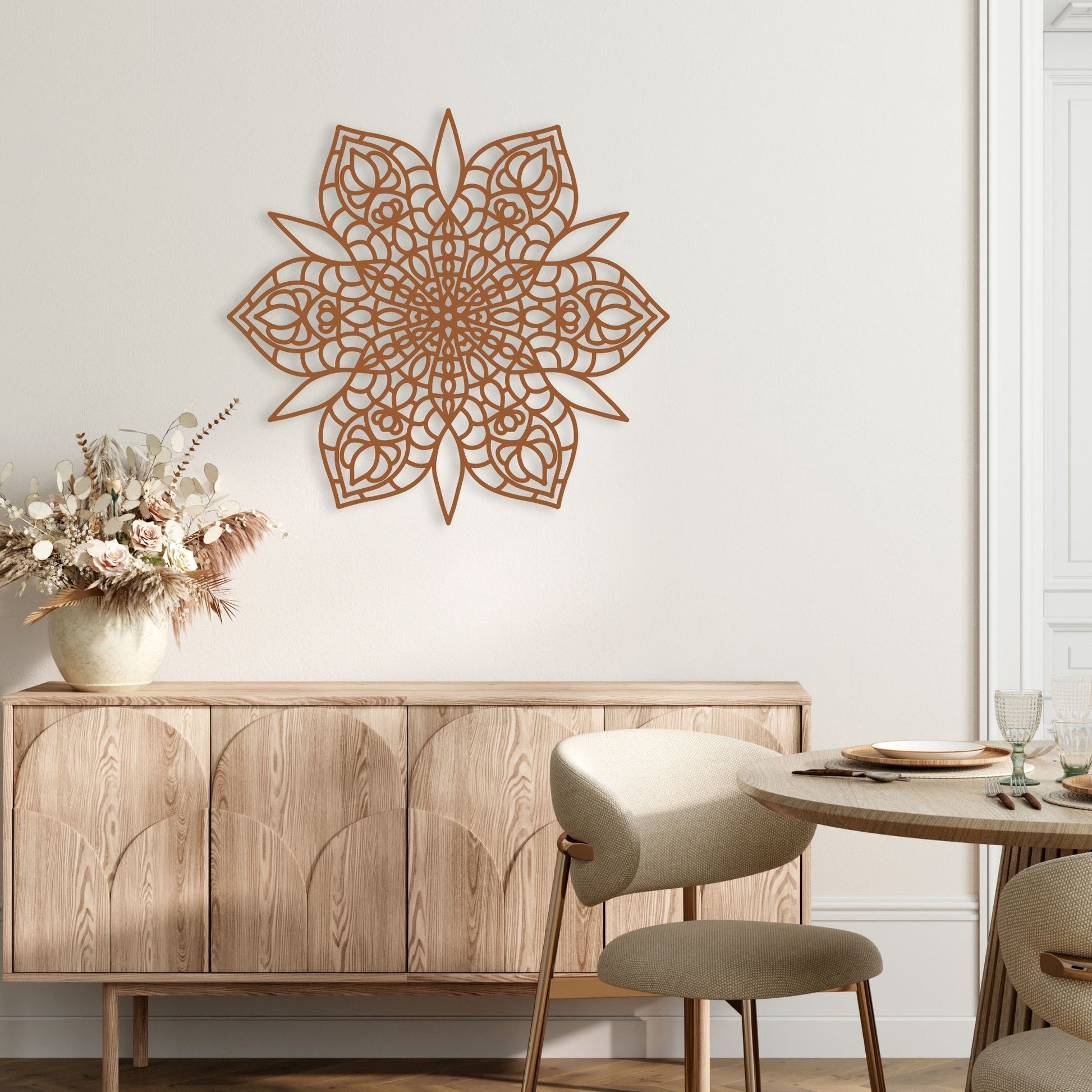 Decorative wall art above a wooden cabinet in a room with a table and chairs.