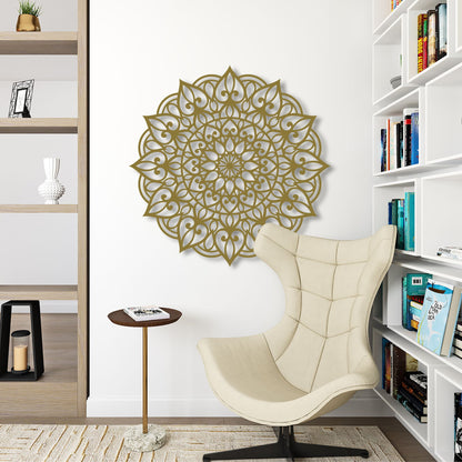 Decorative wall art above a beige armchair in a room with bookshelves.