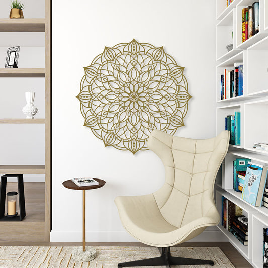 Decorative wall art in a room with a beige chair and bookshelf.