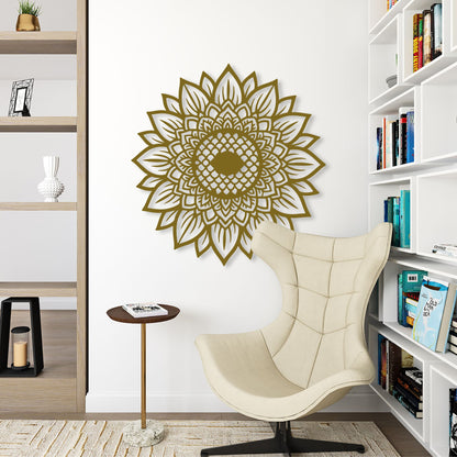 Decorative wall art in the shape of a mandala on a white wall above a beige armchair.