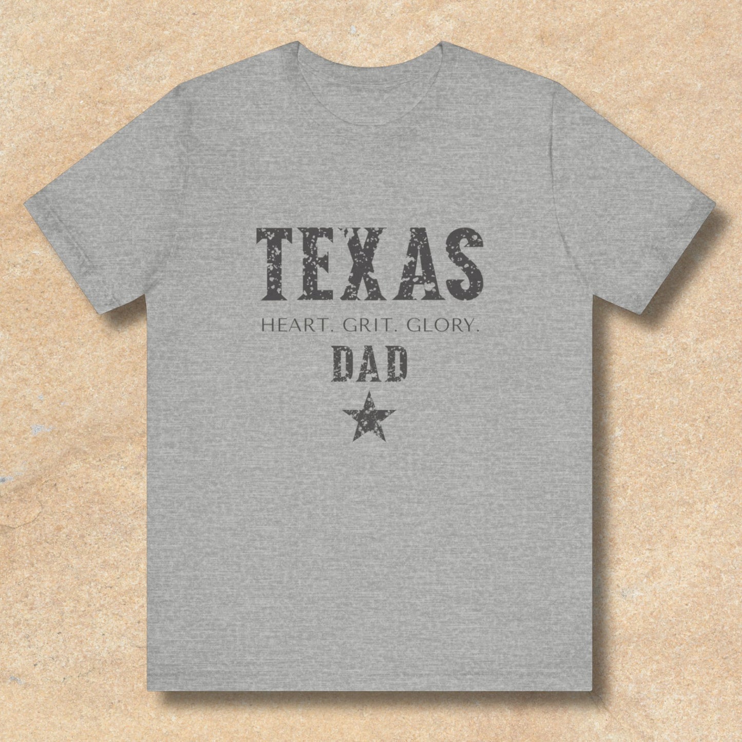 Gray t-shirt with 'Texas Dad' text on a beige background