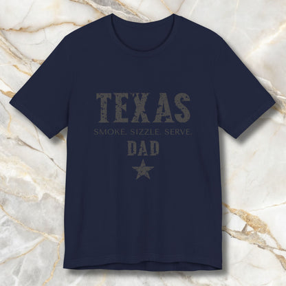 Navy blue t-shirt with 'TEXAS SMOKE SIZZLE SERVE DAD' text on a marble background