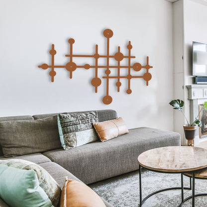Living room with a gray sectional sofa, decorative pillows, and a modern wall art piece.