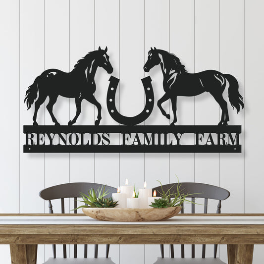 Decorative metal wall art with horses and a horseshoe, featuring 'Reynolds Family Farm' text, on a white wooden panel background.