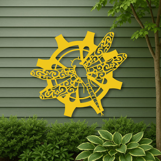 Decorative yellow metal wall art on a green wooden wall with plants below.