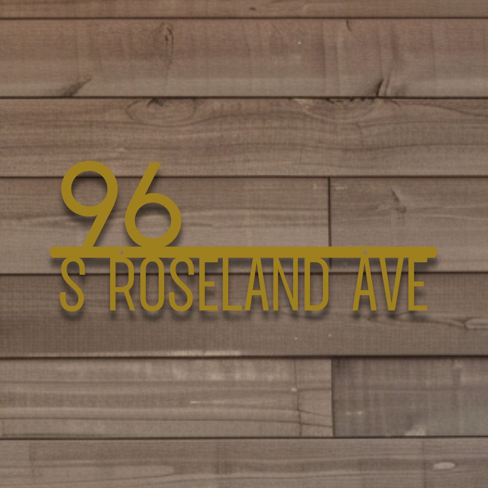 Address '96 S Roseland Ave' in gold on a wooden background