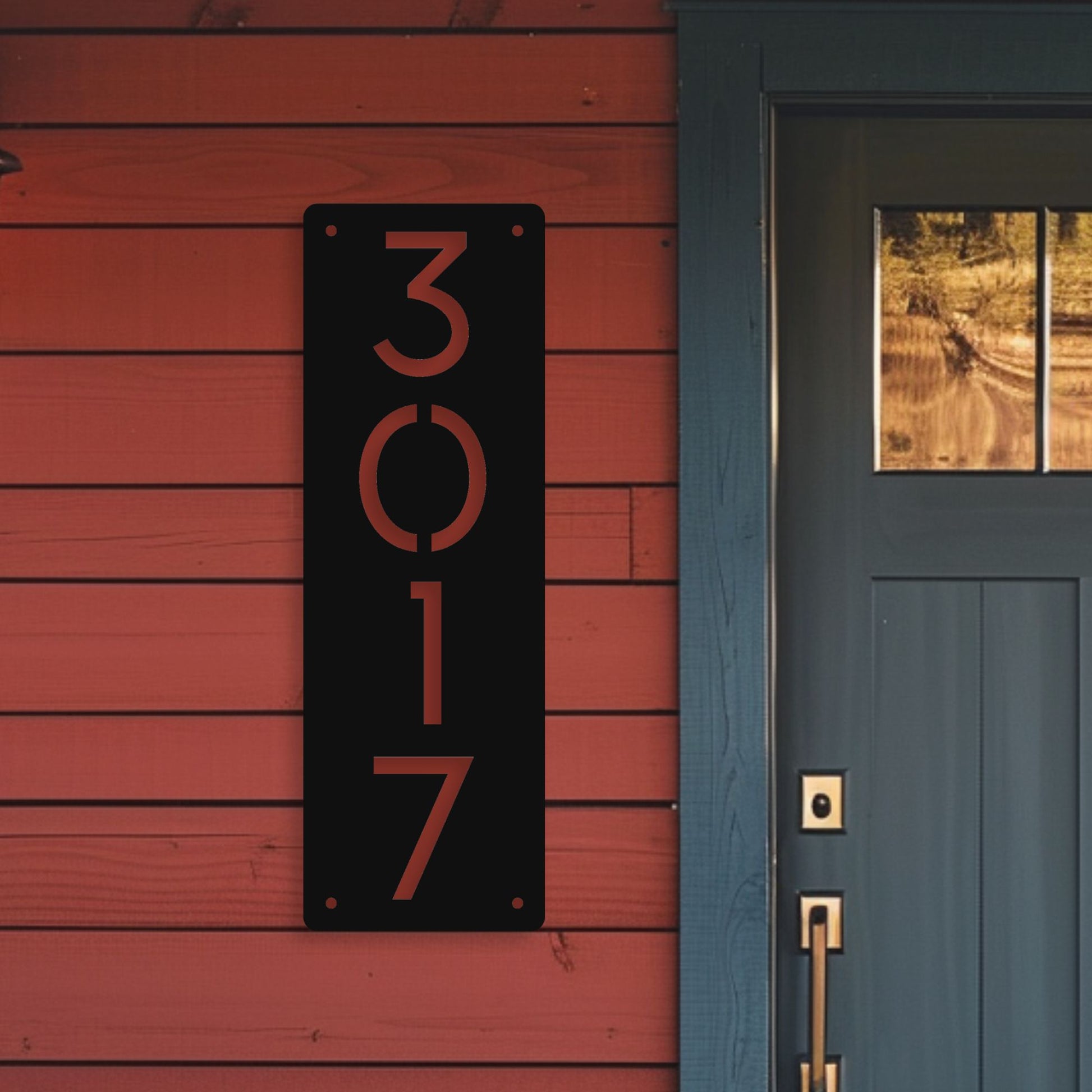 House number '3017' on a red wooden wall next to a blue door.