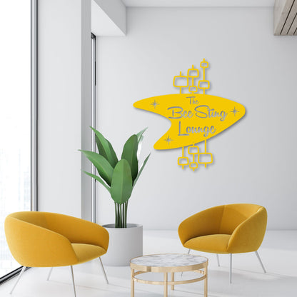 Personalized Mid Century Modern Name Sign shown hanging over modern business lounge in yellow color