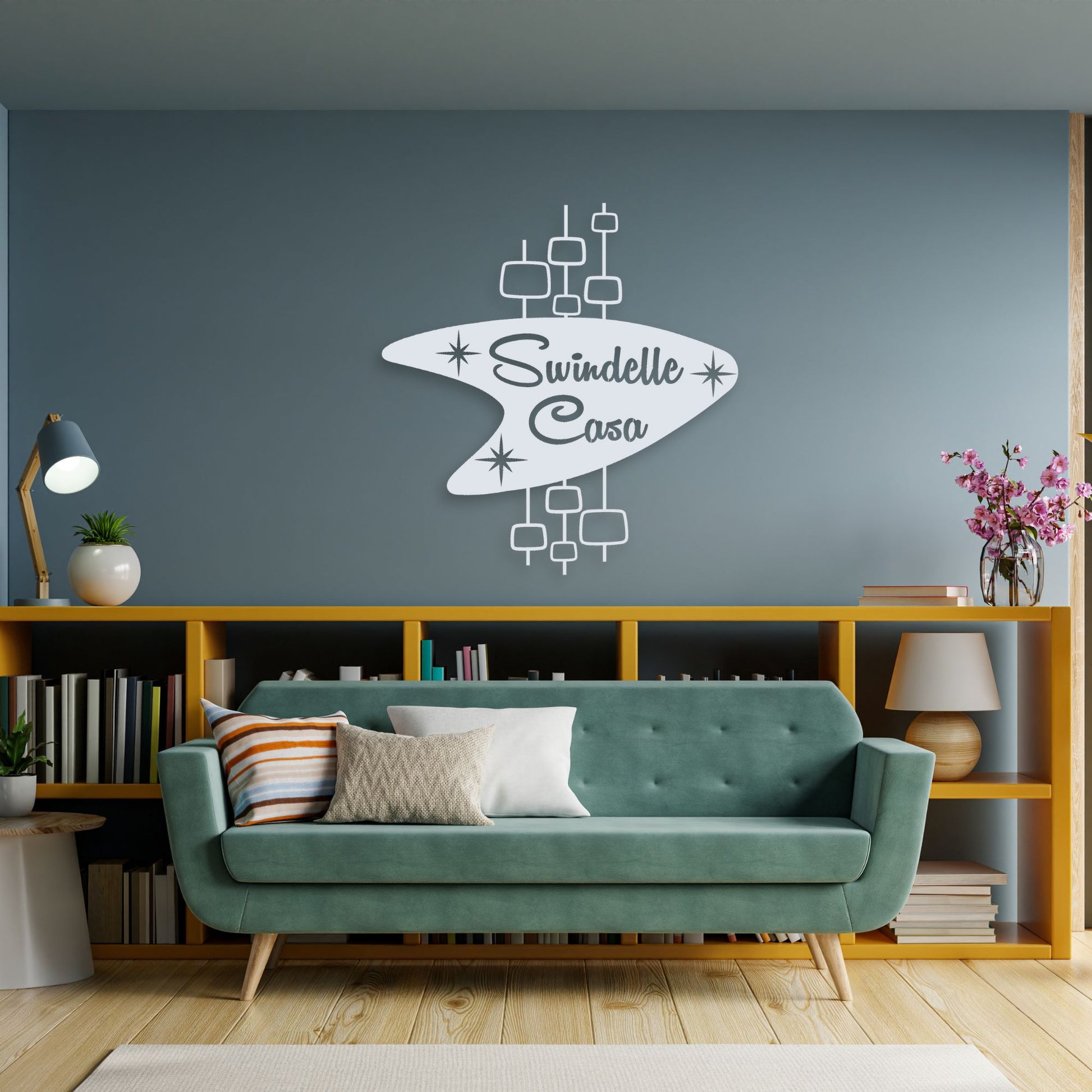 Personalized Mid Century Modern Name Sign in white hanging over modern living room couch