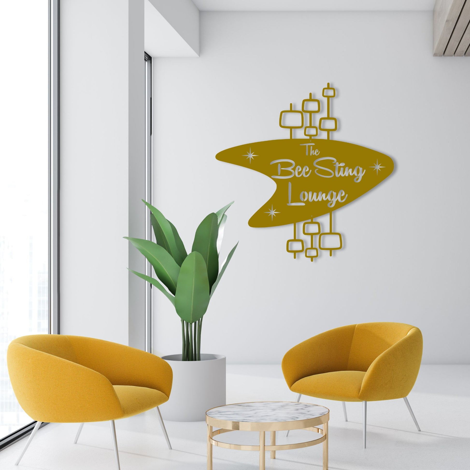Personalized Mid Century Modern Name Sign shown hanging over modern business lounge in gold color