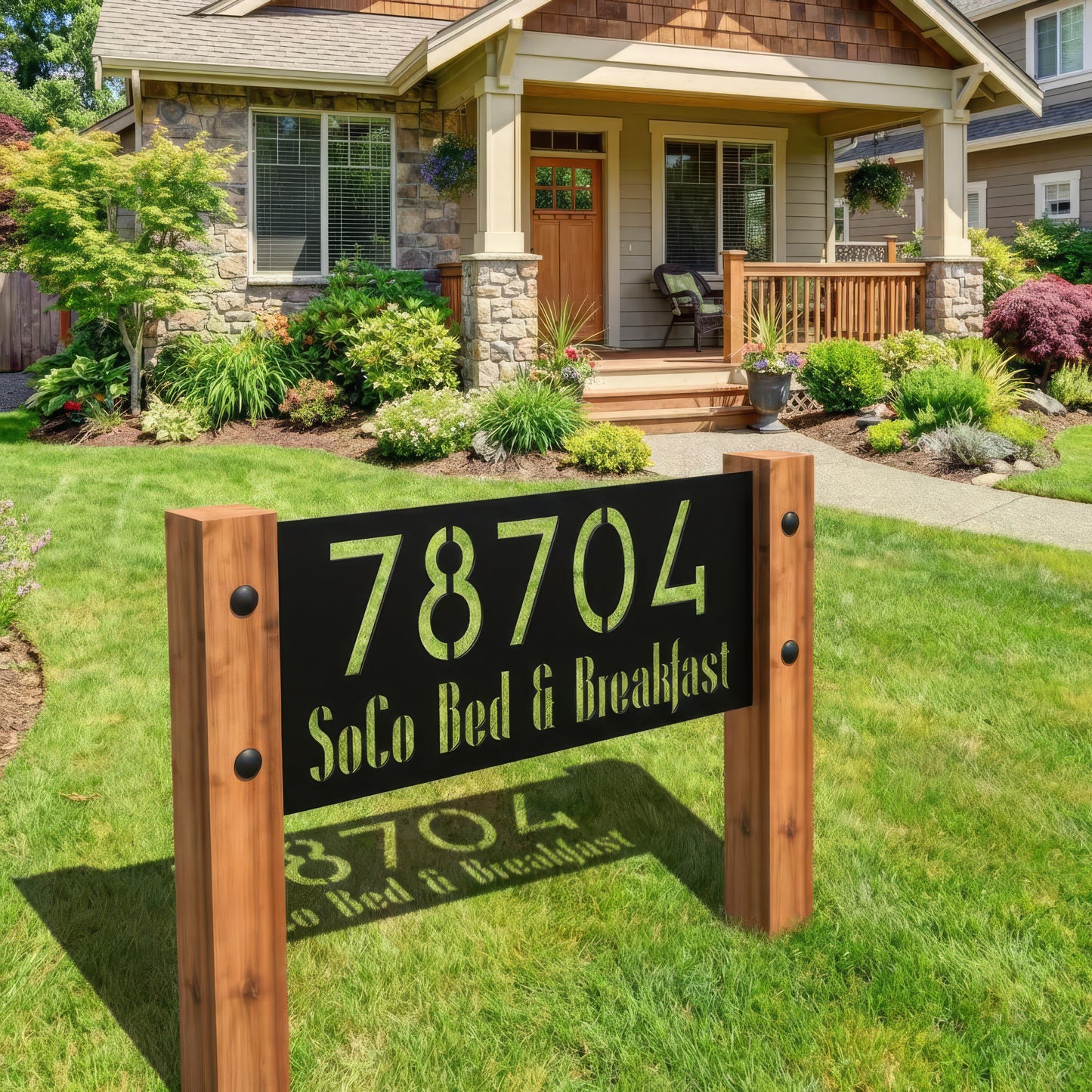 Wooden sign with '78704 SoCo Bed & Breakfast' in front of a house with a garden.