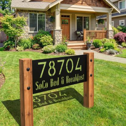 Wooden sign with '78704 SoCo Bed & Breakfast' in front of a house with a garden.