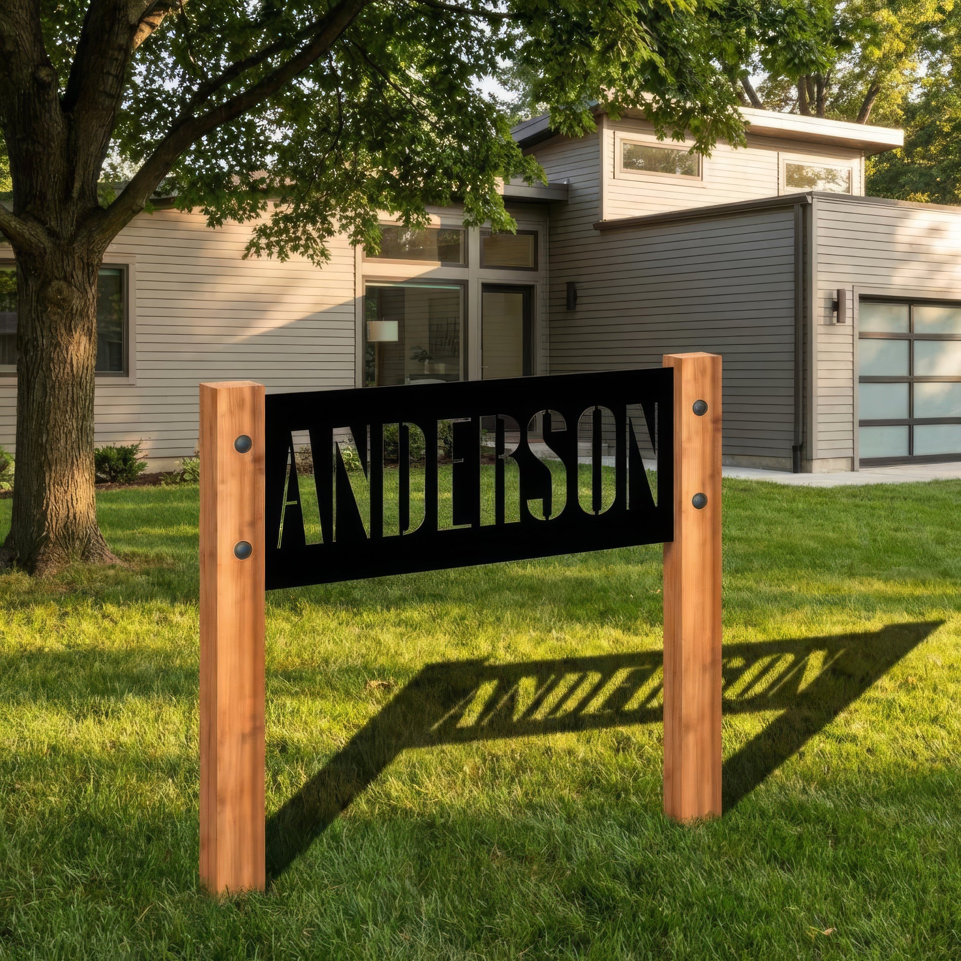Wooden sign with 'ANDERSON' text in front of a house