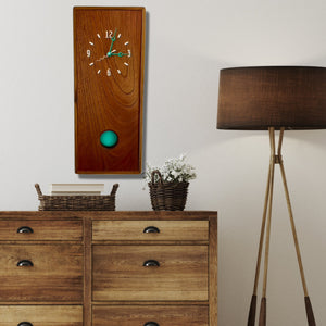 KingWood Pendulum Wall Clock In Cedar & Turquoise over bedroom dresser on wall