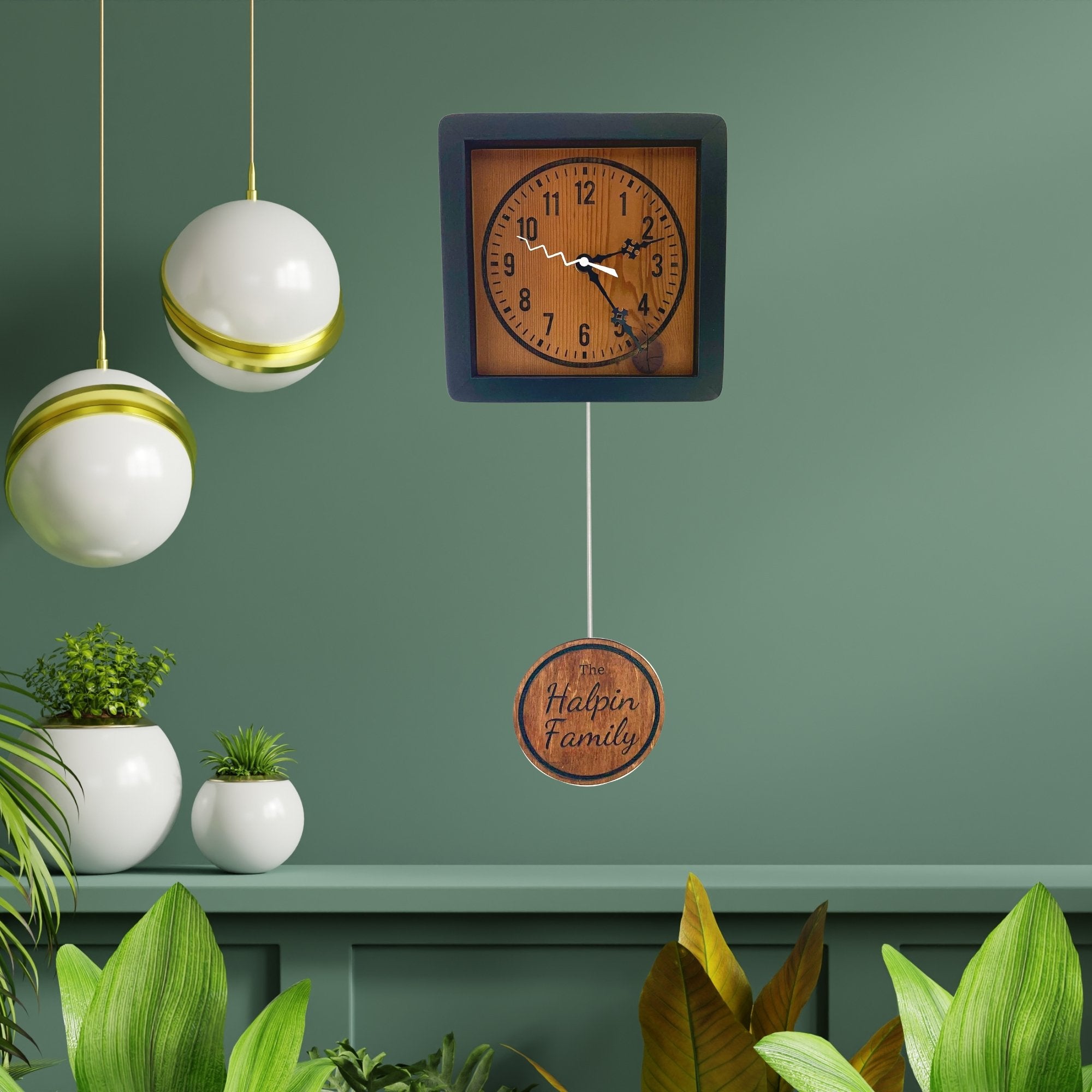KingWood Personalized Pendulum Wall Clock against a green wall