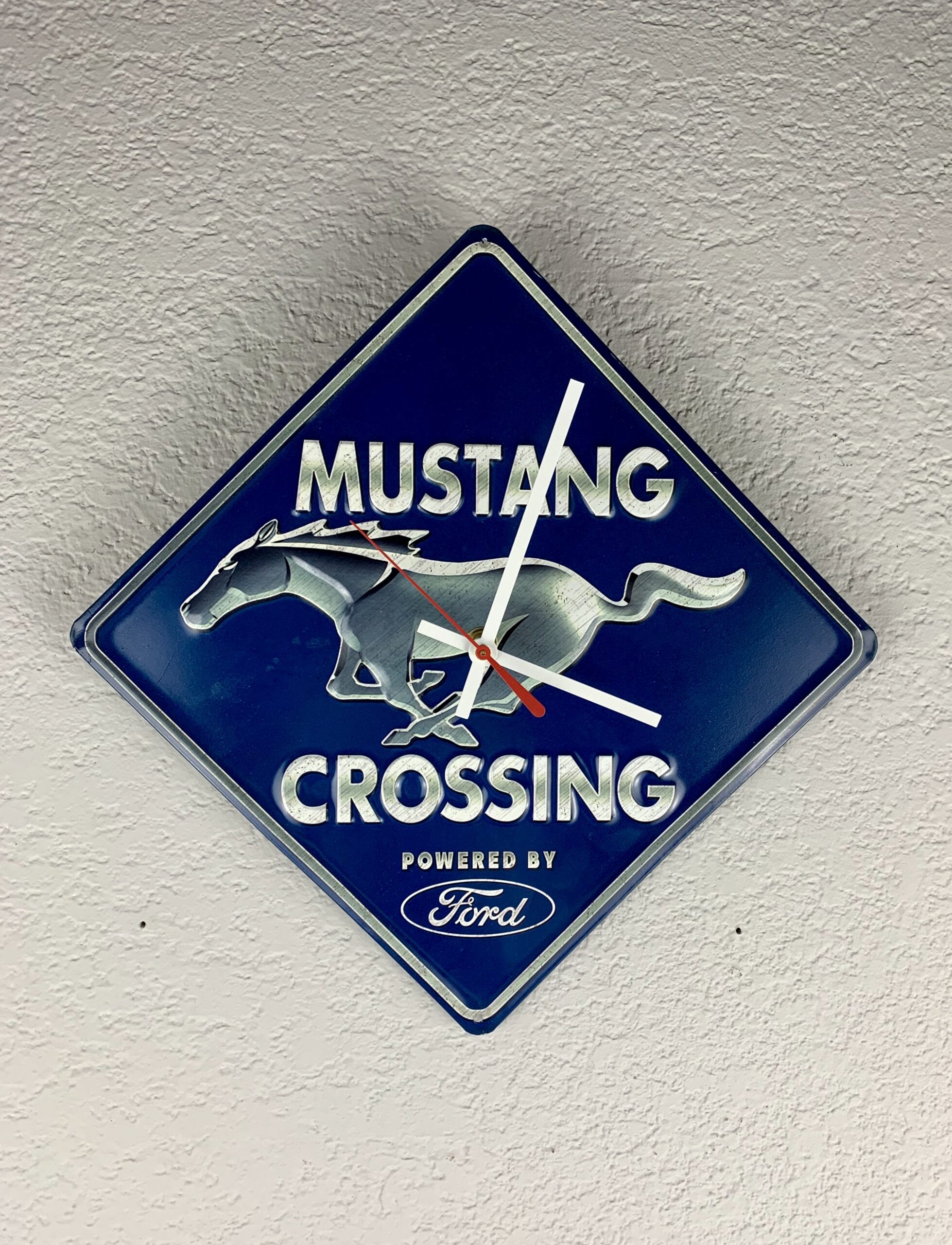 Ford Mustang Metal Sign Wall Clock on grey wall