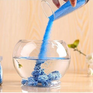 Colorful Magic Sand poured into water