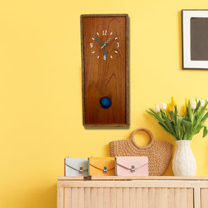 KingWood Pendulum Wall Clock In Cedar & Blue on yellow wall in living room