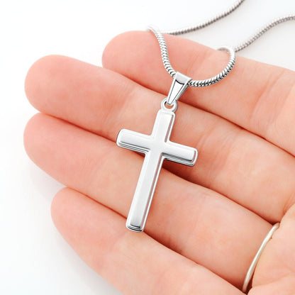 cross necklace in hand