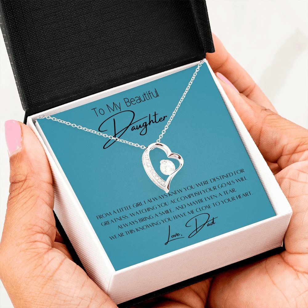 To My Daughter Heart Necklace & Gift Message, From Dad, Blue held by recipient daughter